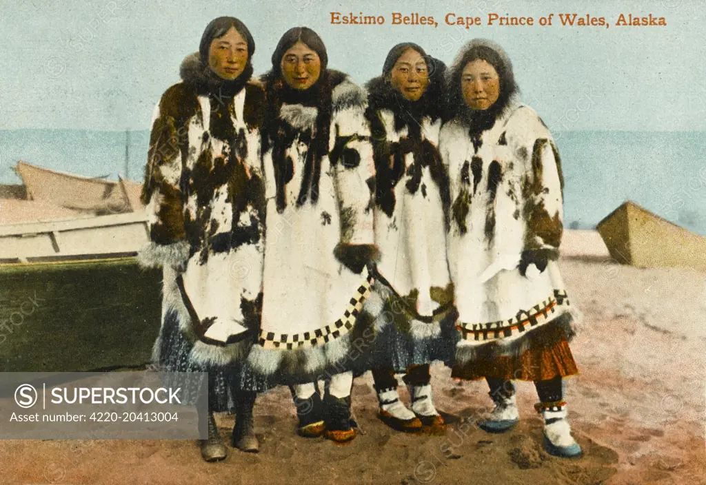 Four Eskimo Ladies from Cape Prince of Wales, Alaska. The woman on the left is wearing (interestingly) a very western pair of lace-up shoes as opposed to her fellows in traditional fur boots!     Date: 1912