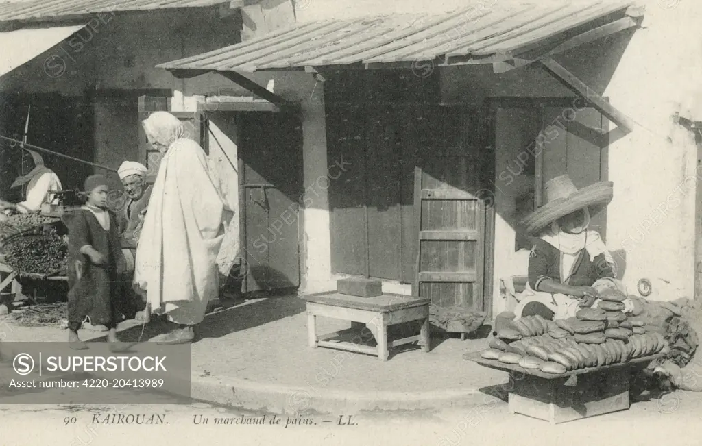 Tunisia - Kairouan - Street bread seller     Date: circa 1910s