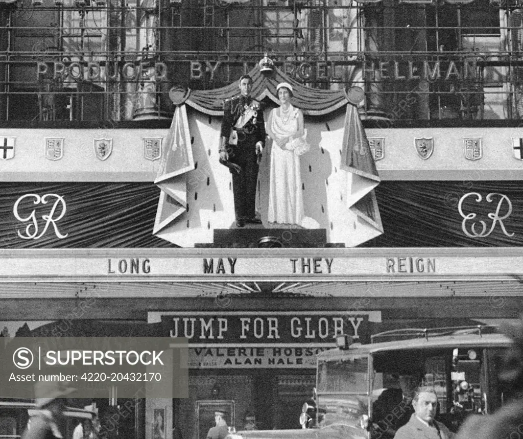 Among the decorations in London inspired by the Coronation of King George VI and Queen Elizabeth were these life-size effigies of the royal couple, the focal point of the elaborate decorations on the facade of the London Pavilion.       Date: 1937
