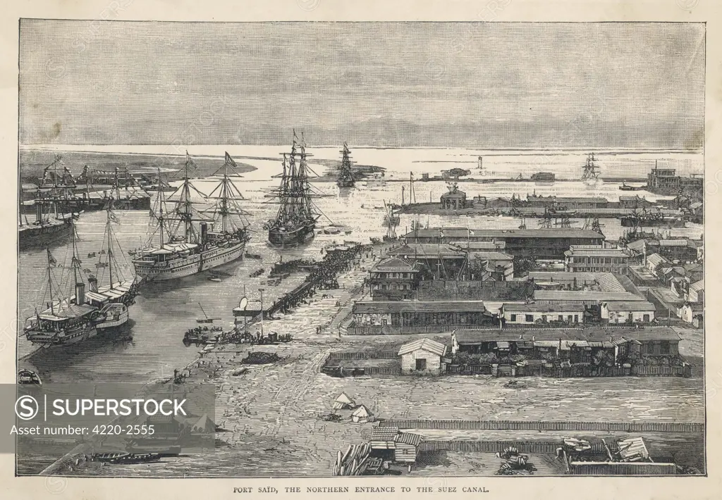Ships load and unload at docks in Port Said, at theNorthern entrance to theSuez Canal. Date: circa 1880
