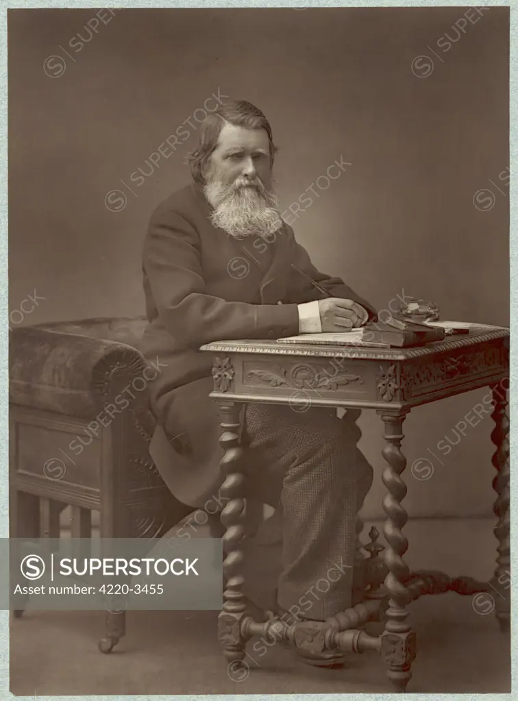 JOHN RUSKIN  English art critic and writer  Photograph sitting at his desk      Date: 1819 - 1900