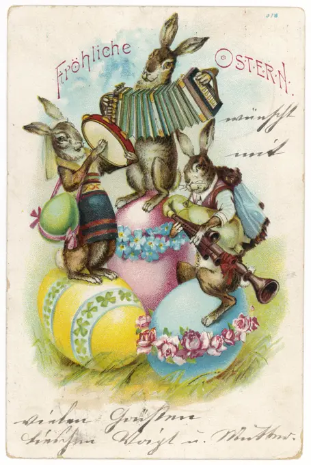 Three musical hares play their instruments on three decorated Easter eggs.           Date: 1906