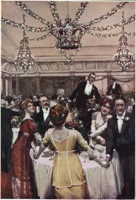 Guests at the Savoy Hotel, London, join hands and sing  'Auld Lang Syne' as the clock strikes midnight and the Old  Year gives way to the New     Date: 1912