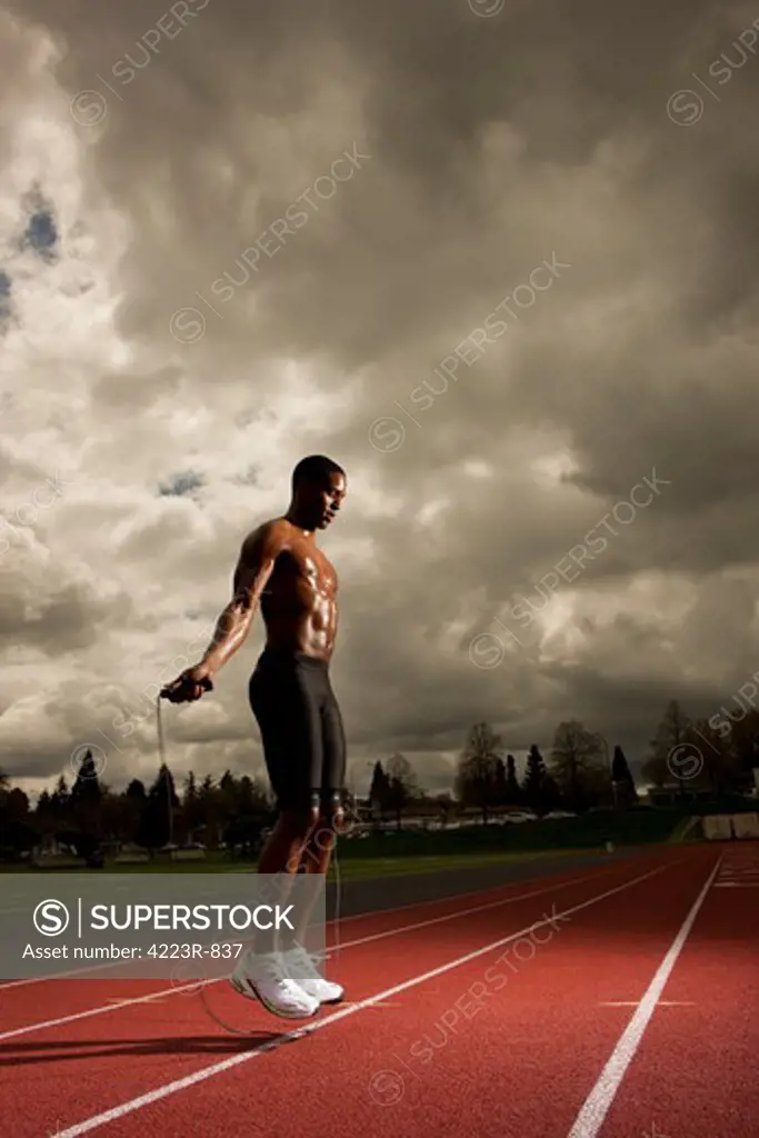 Man jumping rope on track