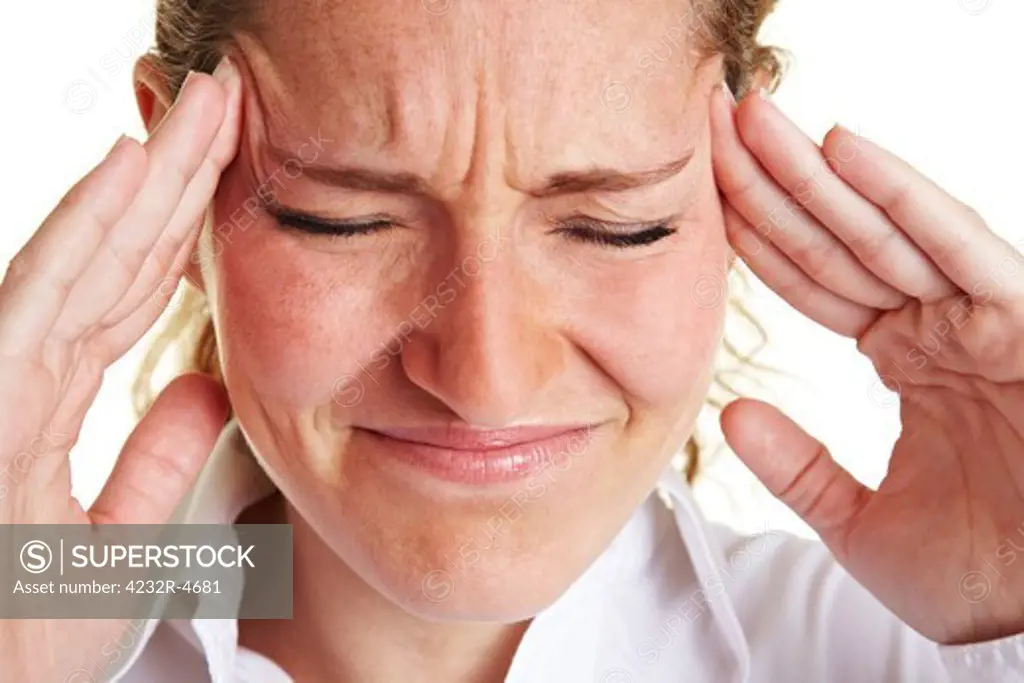 Business woman with headache massaging her aching temples