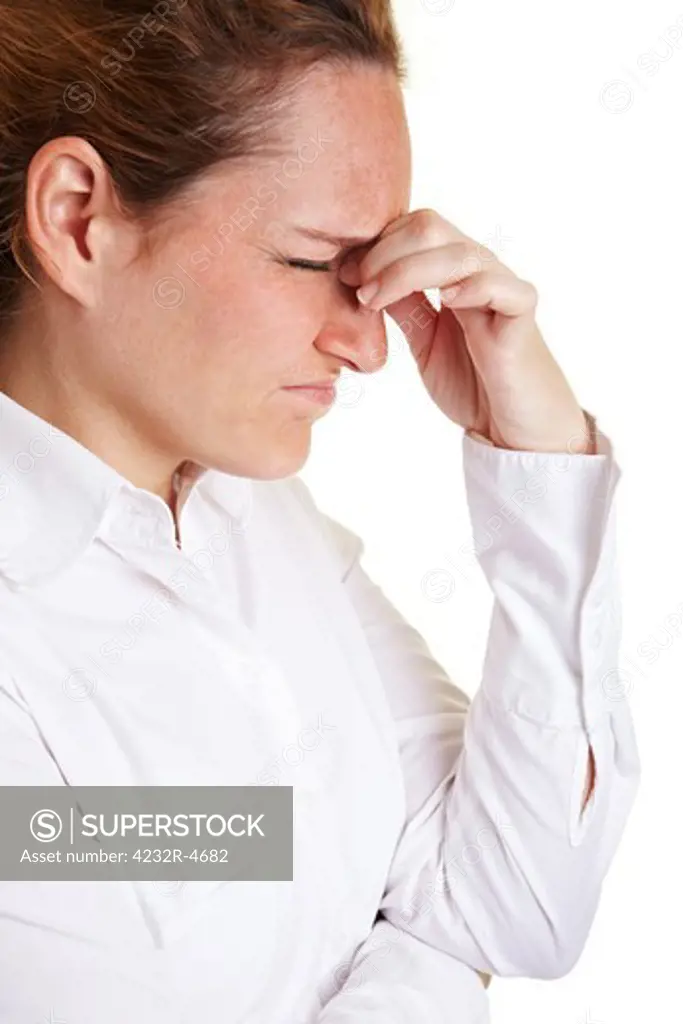 Business woman with migraine massaging bridge of nose