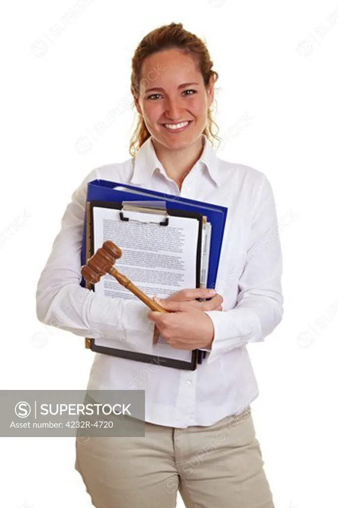 Young female judge with gavel and files