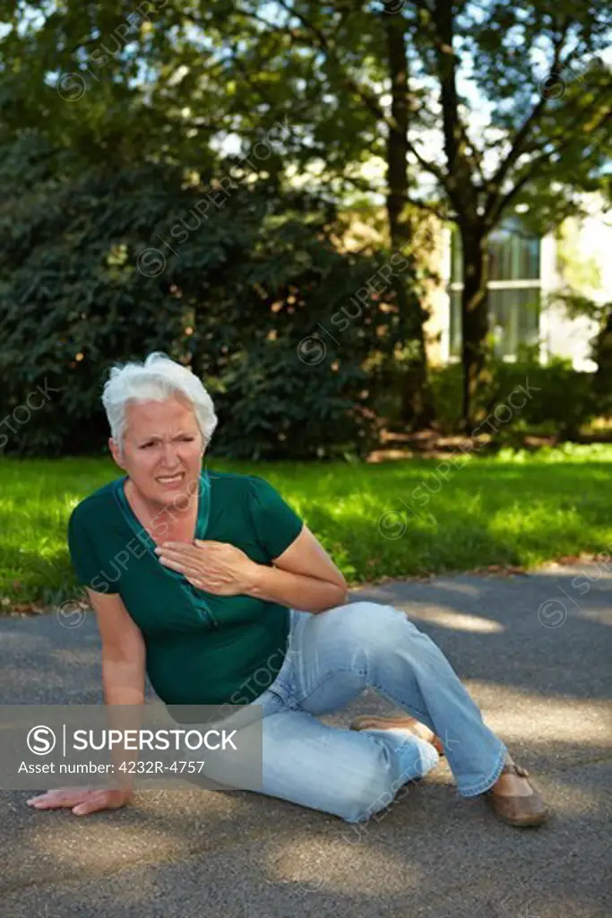 Senior woman sitting with stroke in park