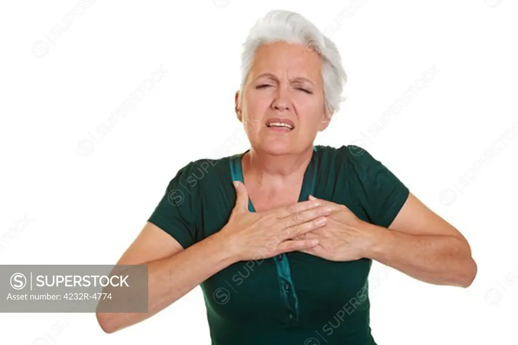 Senior woman having coronary and holding hand to her chest