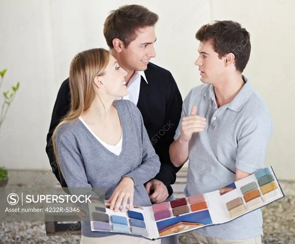 Couple looking at different carpet samples at floorlayer