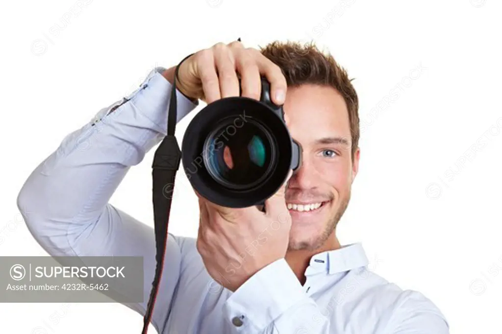 Happy professional photographer with digital DSLR camera