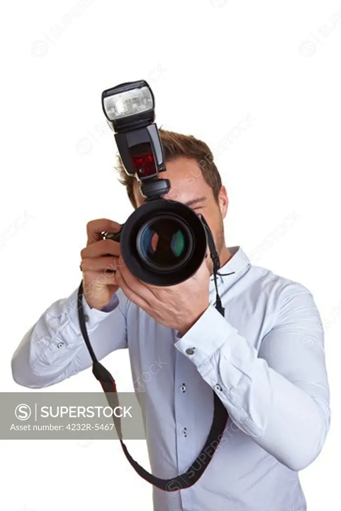 Wedding photographer taking pictures with digital camera and flash unit
