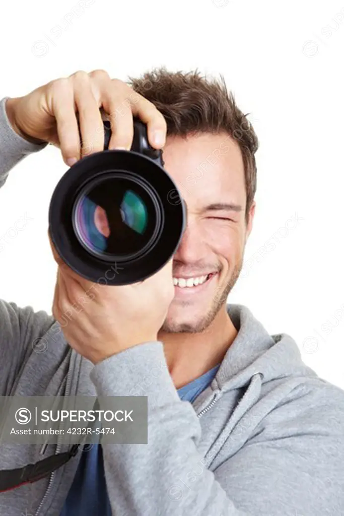 Young photographer taking pictures with digital camera