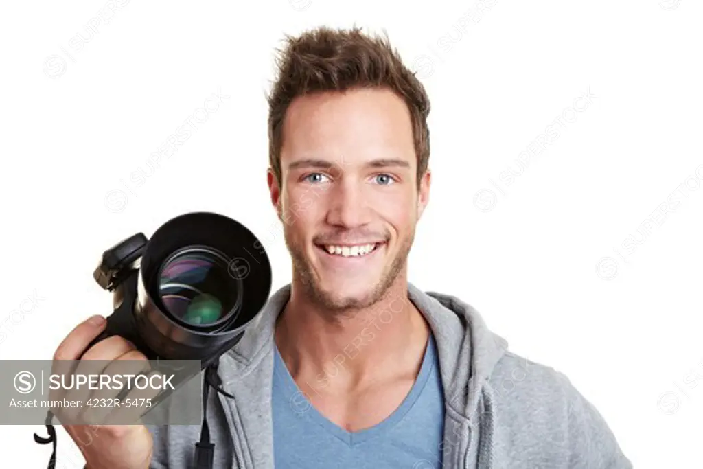 Happy photographer holding digital camera with remote trigger