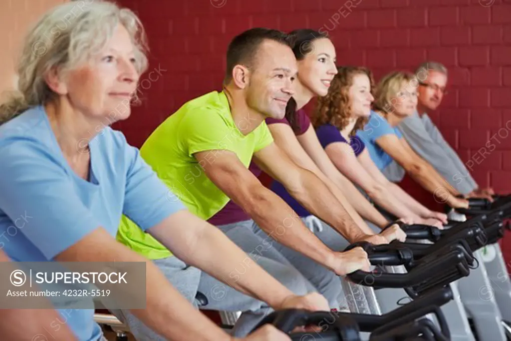 Spinning class exercising in a fitness center