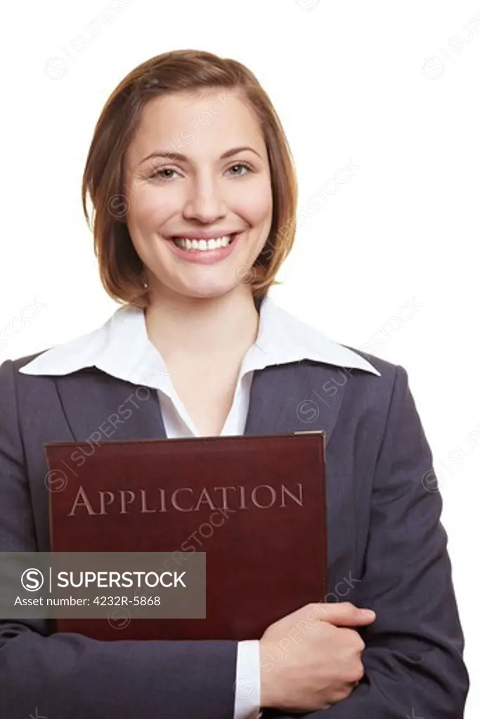 Smiling female applicant holding application folder in her hands