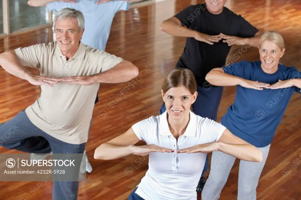 Senior citizens doing dance training in fitness center
