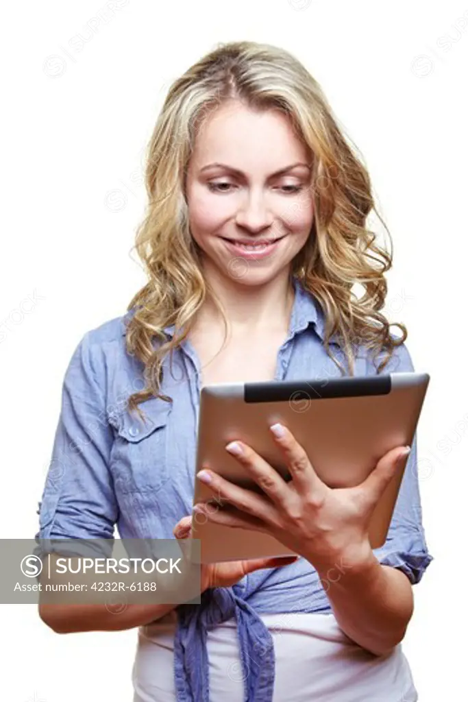 Smiling blonde woman looking at tablet computer