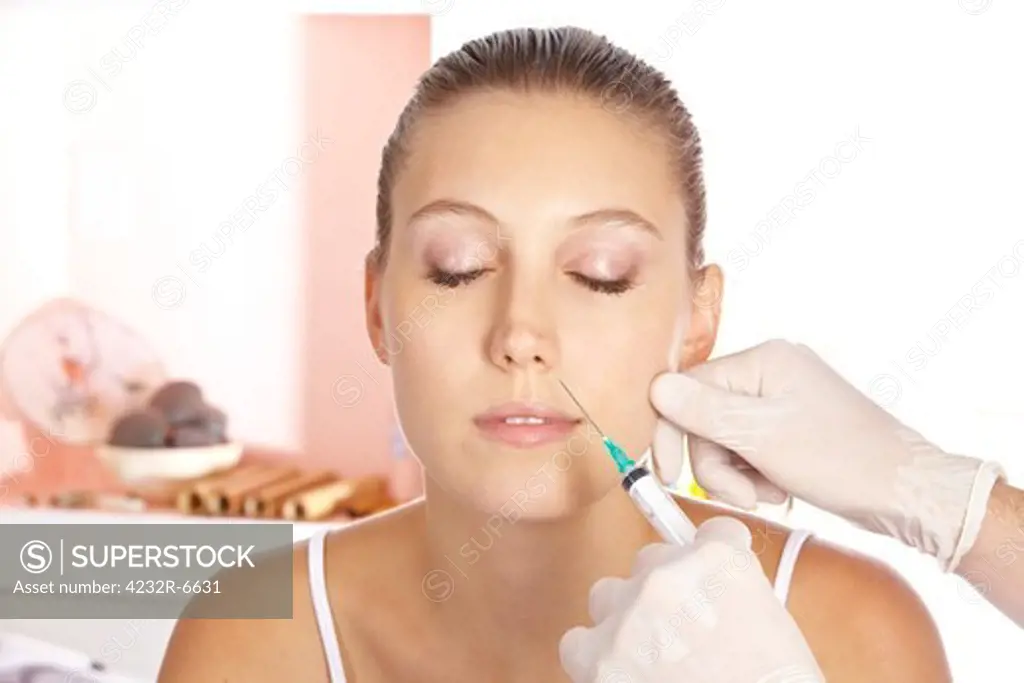 Attractive woman getting a wrinkle treatment with a syringe