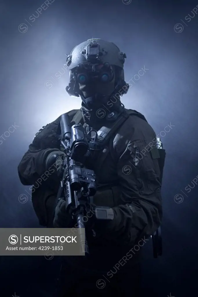 Special operations forces soldier equipped with night vision and an automatic weapon.