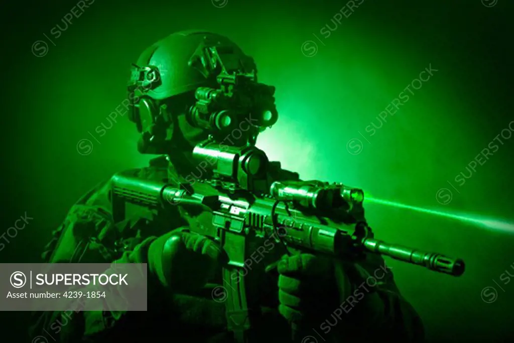 Special operations forces soldier equipped with night vision and an HK416 assault rifle.