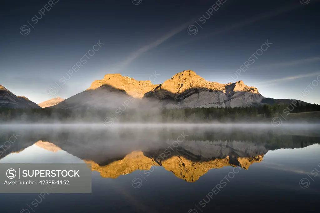 Mist along Mount Kidd and Wedge Pond in the Canadian Rocky Mountains in Kananaskis, Alberta, Canada