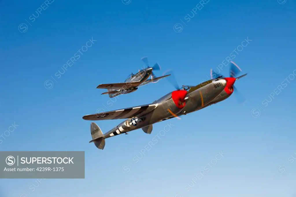 A P-38 Lightning and P-51D Mustang in flight over Chino, California