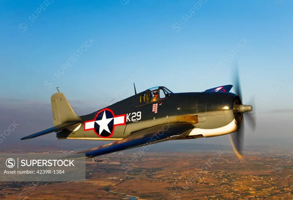A Grumman F6F Hellcat fighter plane in flight over Chino, California