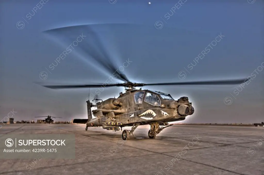 Tikrit, Iraq - High dynamic range image of an AH-64D Apache Longbow Block III attack helicopter as it reverses out of its pad for a mission in support of U