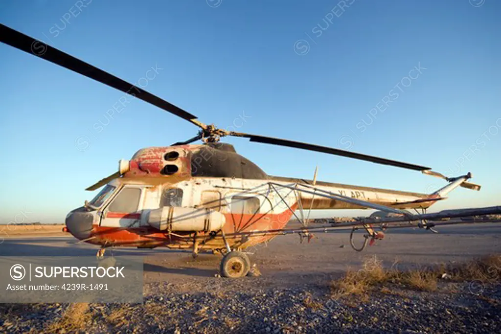 Baqubah, Iraq - An Iraqi Mi-2 helicopter sits on the flight deck abandoned at Camp Warhorse