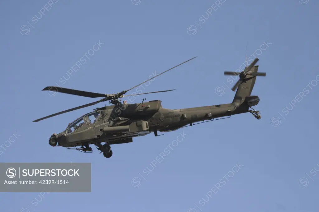 An AH-64 Apache in flight over the Baghdad Hotel in central Baghdad, Iraq