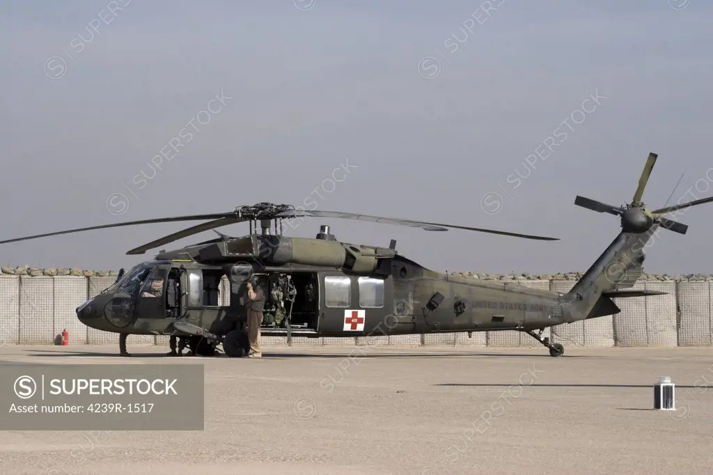 Baqubah, Iraq - A UH-60 Blackhawk Medivac helicopter refuels at Camp Warhorse after a mission