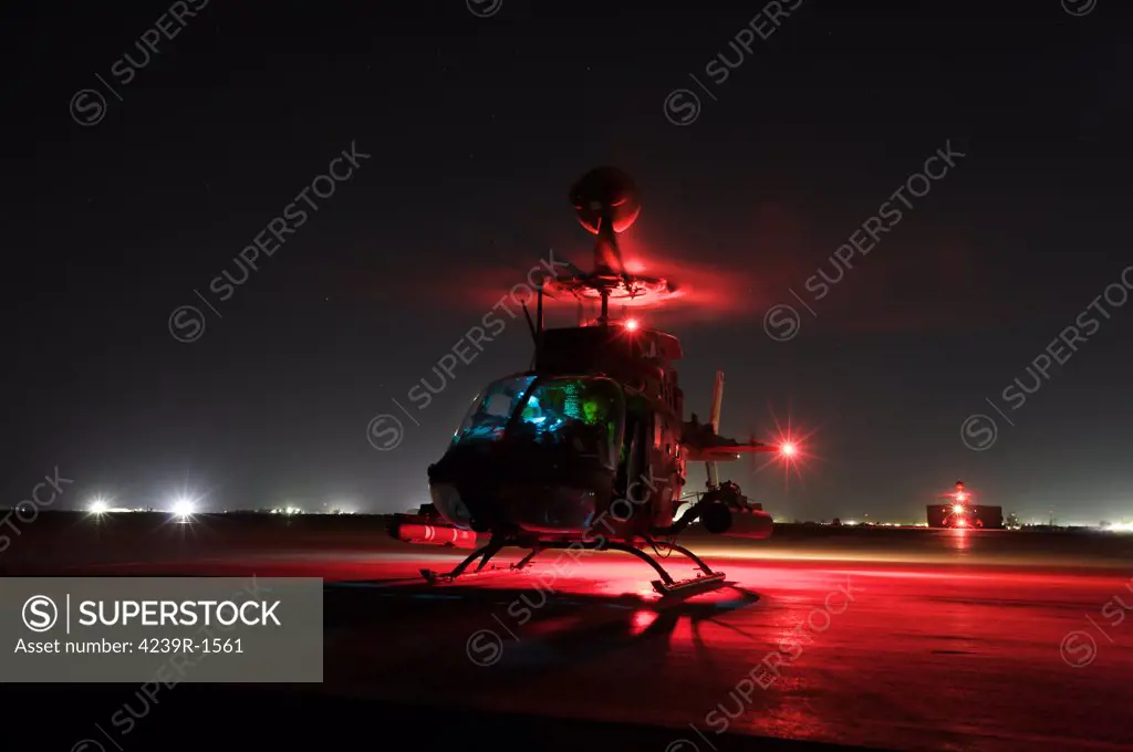 Tikrit, Iraq - OH-58D Kiowa pilots from the 6th Squadron, 17th Cavalry Regiment, run through their pre-flight checks before taking off on a mission in support of Operation Iraqi Freedom