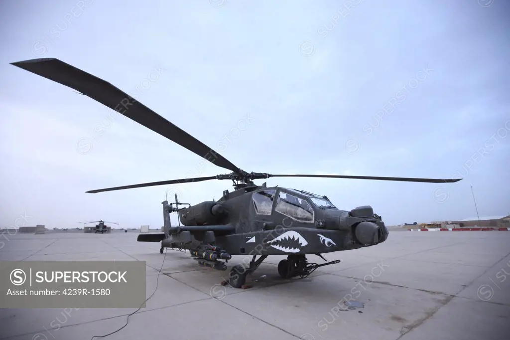 An AH-64D Apache Longbow Block III attack helicopter prepares for takeoff at Camp Speicher
