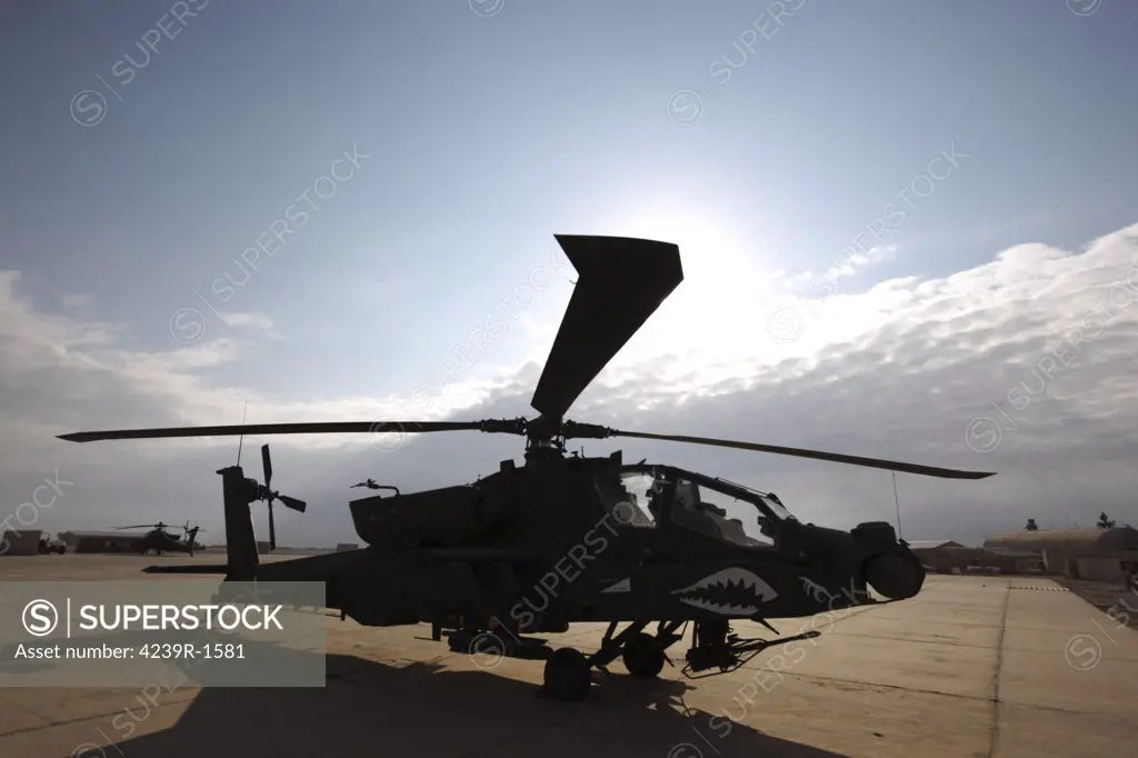 An AH-64D Apache Longbow attack helicopter sits on the flight line at Camp Speicher