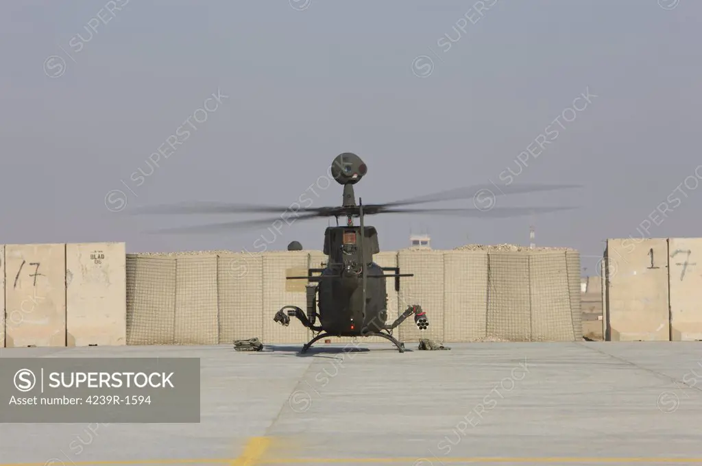 Rear view of a OH-58D Kiowa Warrior parked on the flight line at Camp Speicher, Iraq