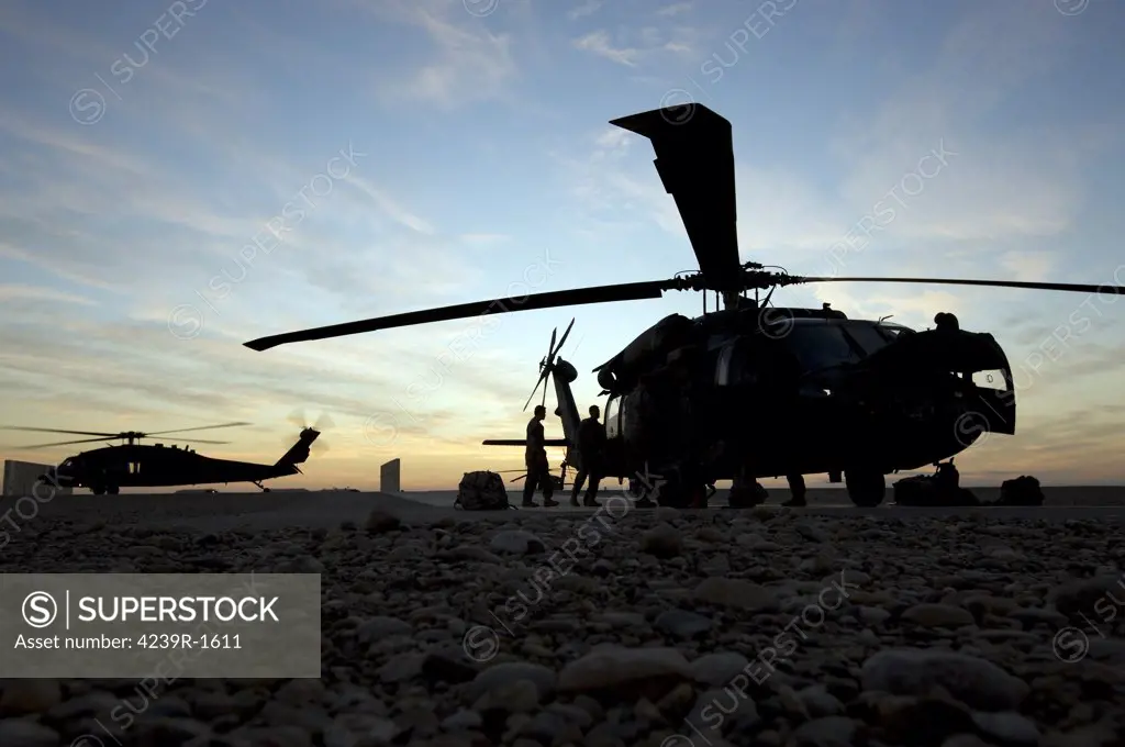 Tikrit, Iraq - A UH-60 Black Hawk helicopter on the flight line at sunset
