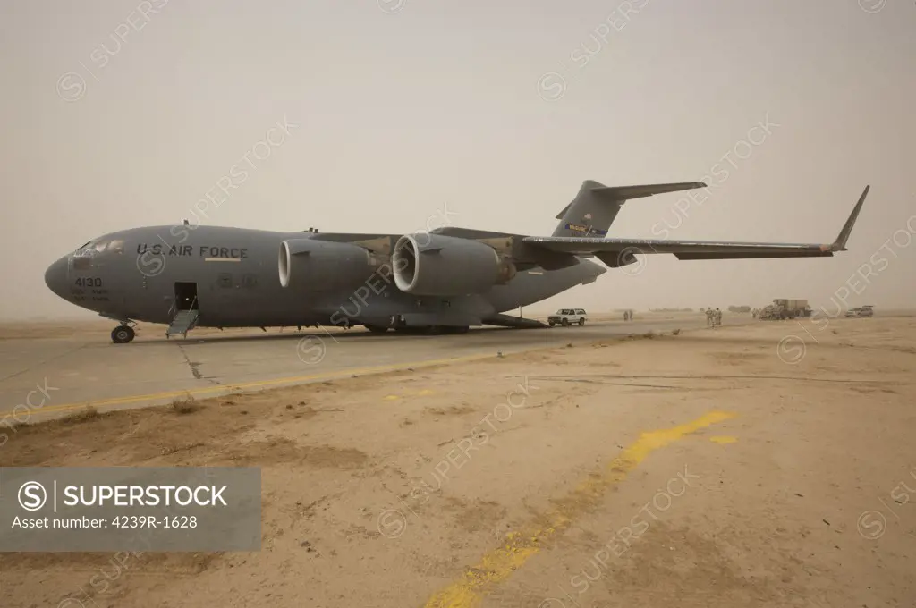 A C-17 Globemaster III sits on the runway at COB Speicher, Iraq