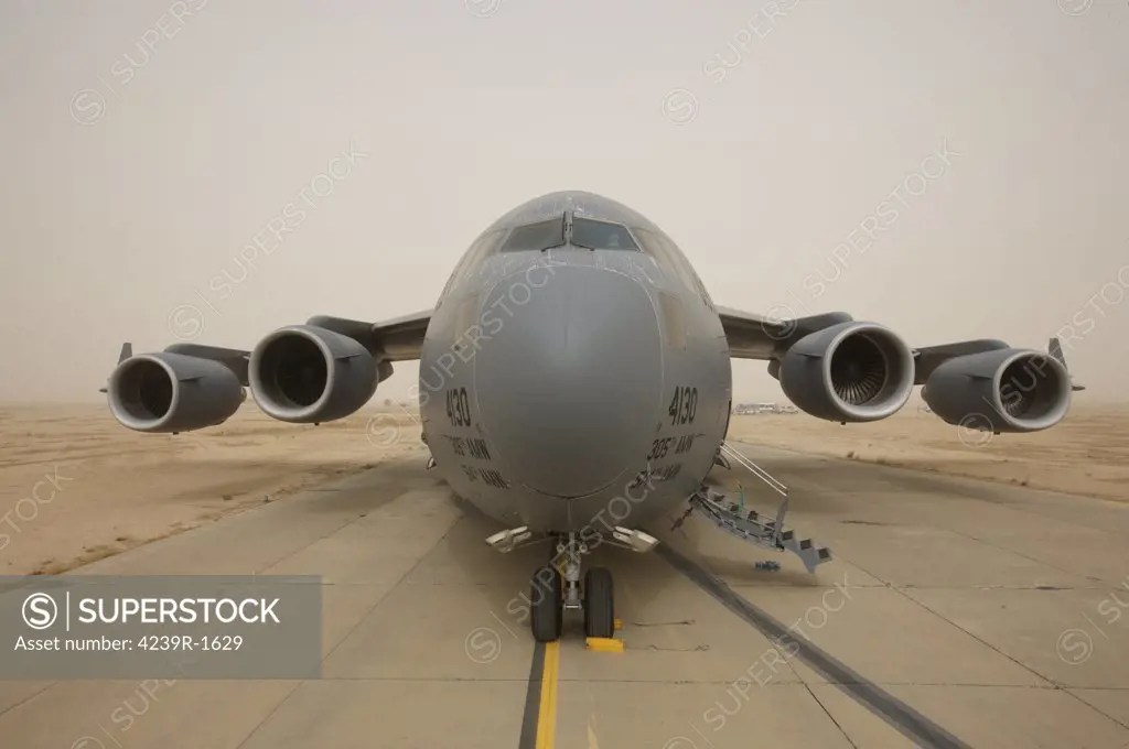 A C-17 Globemaster III sits on the runway at COB Speicher, Iraq
