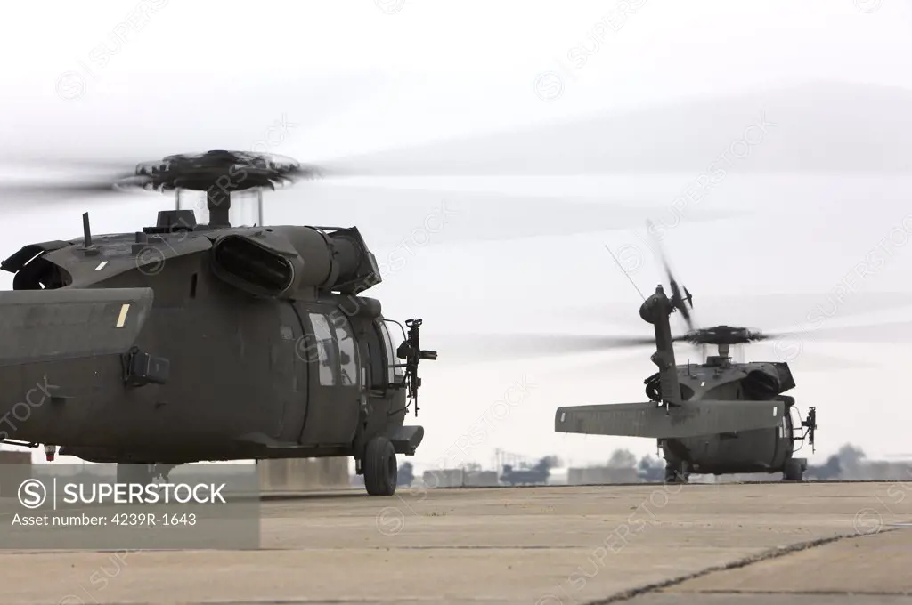 Two UH-60 Black Hawks taxi out for a mission over northern Iraq