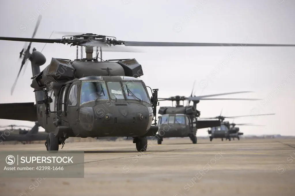 UH-60 Black Hawks taxi out for a mission over northern Iraq