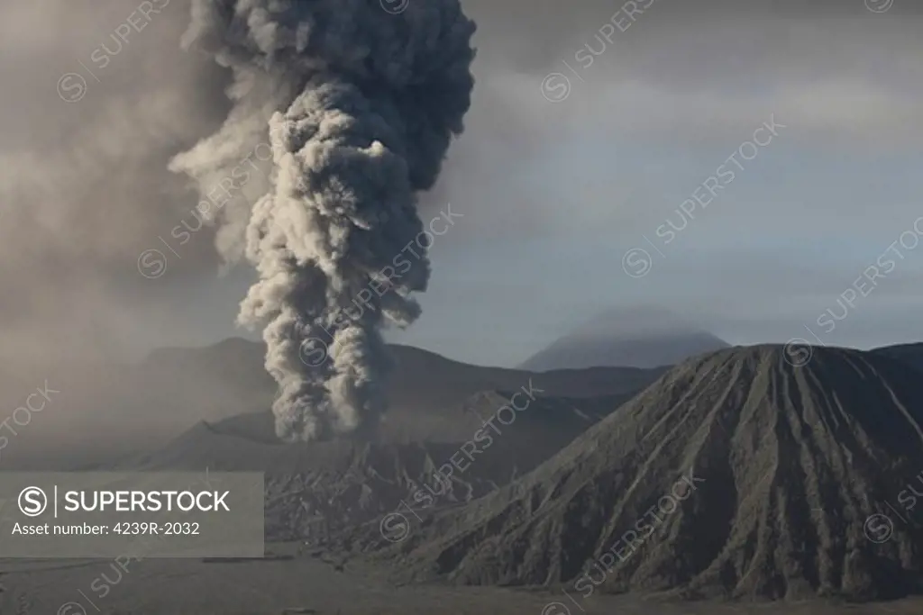 March 19, 2011 - Eruption of ash cloud from Mount Bromo volcano, Tengger Caldera, Java, Indonesia. Batok cone is visible to right and Semeru Volcano in distance.