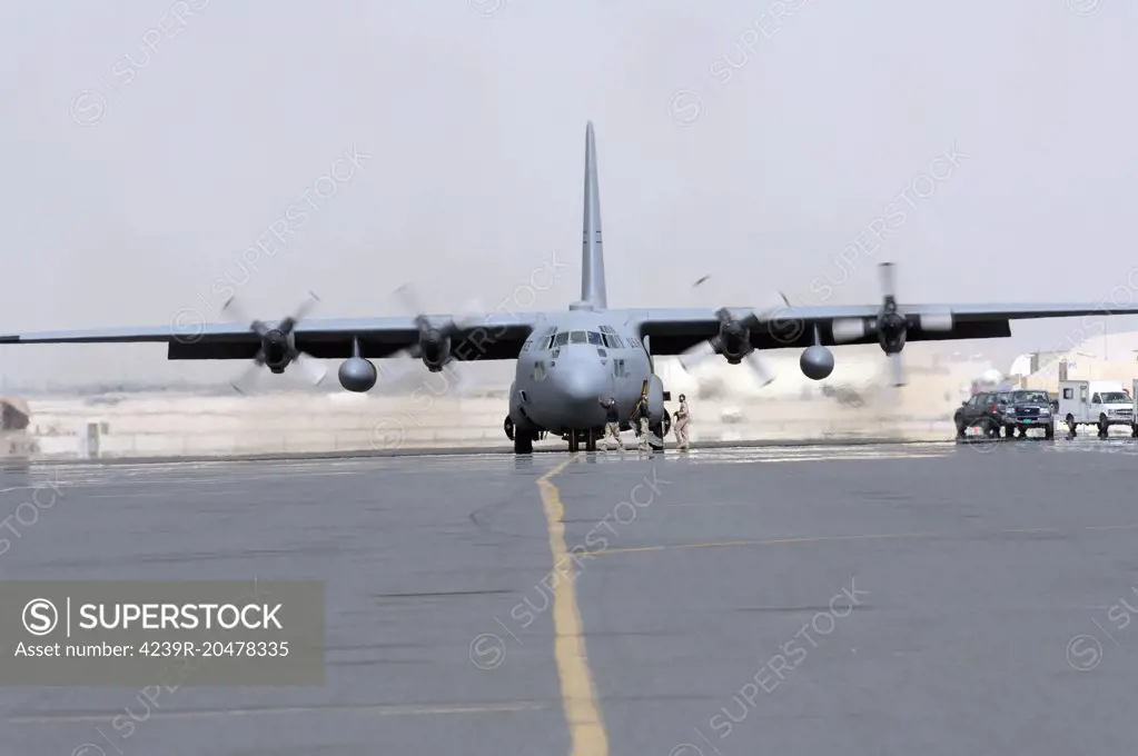 Ground crews prepare a C-130 Hercules for take off before a recent mission. 