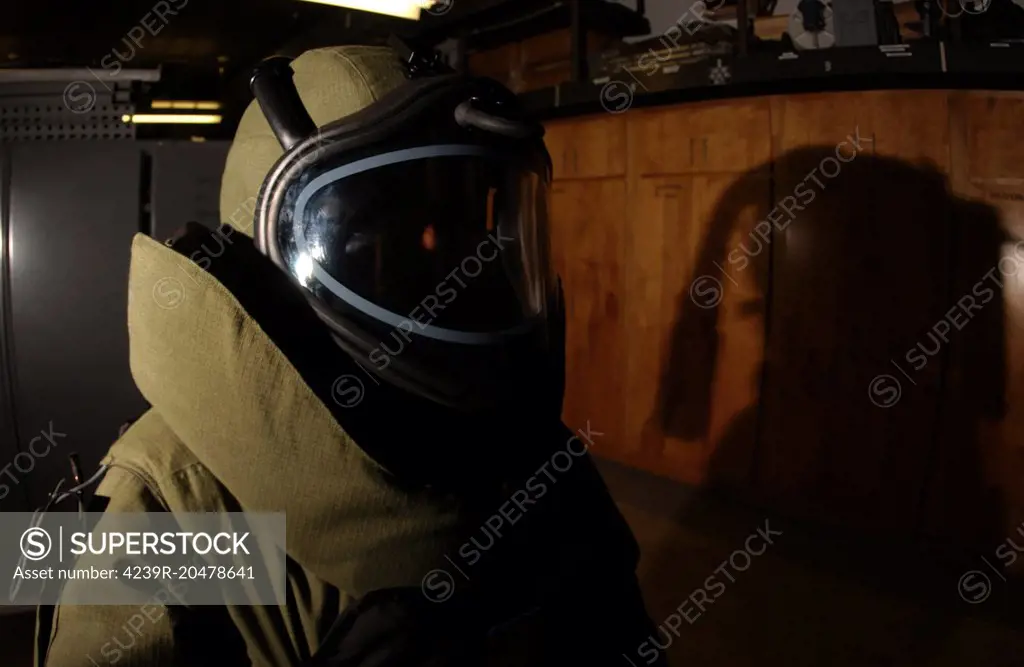 King's Bay, Georgia, June 5, 2003 - Aviation Ordnanceman wears a heavy protective bomb suit during training held by Explosive Ordnance Disposal Mobile Unit aboard the Naval Submarine Base in King's Bay. The suit weighs approximately 100 lbs. and has a self-contained cooling unit that circulates cold water through a special garment worn beneath the armor.  