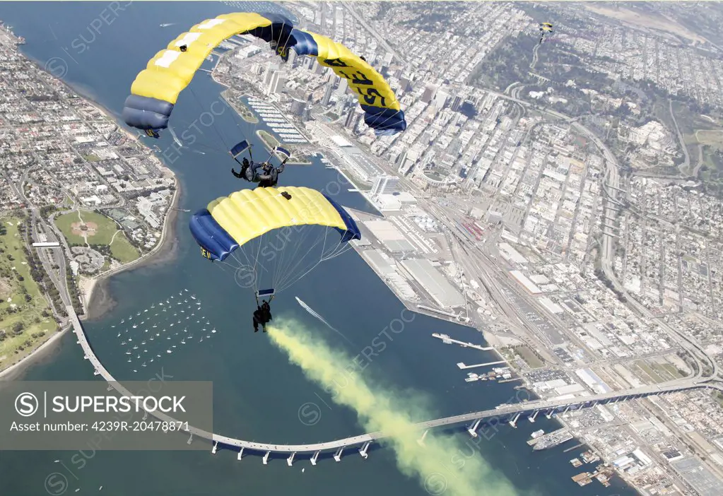 Coronado, California, March 16, 2011 - Members of the U.S. Navy parachute demonstration team, the Leap Frogs, perform a T-formation during a training jump above Naval Amphibious Base Coronado. 