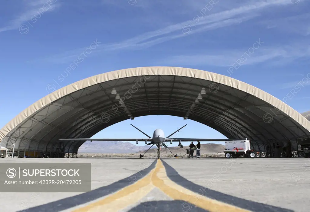 February 28, 2008 - U.S. Airmen stand near an MQ-9 Reaper unmanned aerial vehicle at Nellis Air Force Base, Nevada.