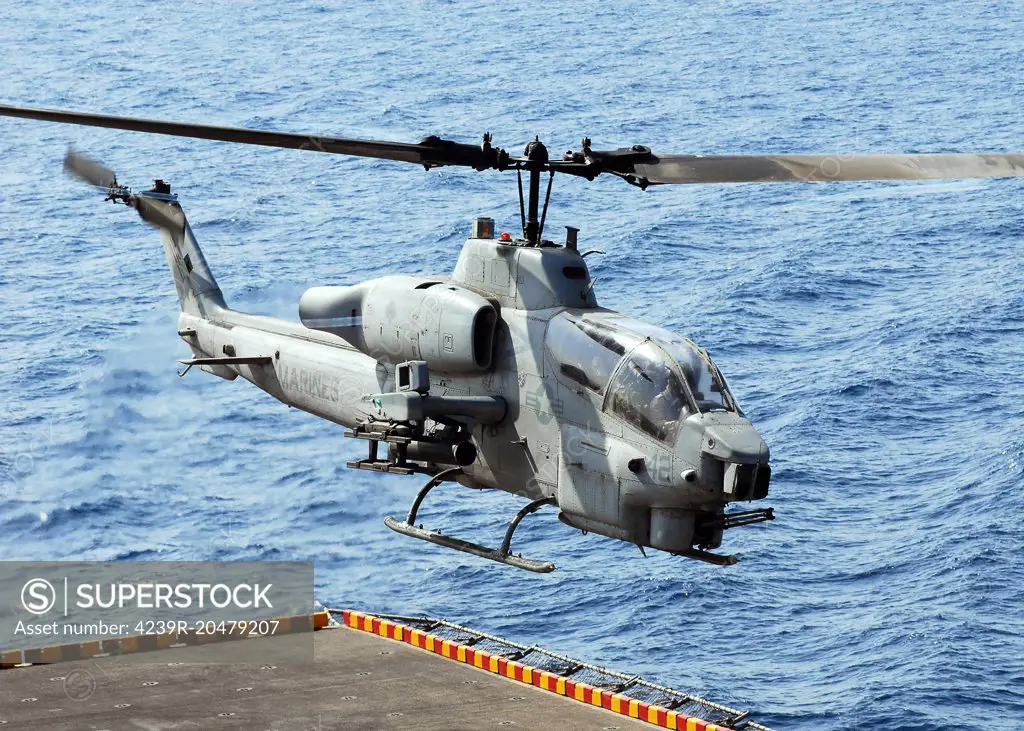 Gulf of Aden, September 2, 2008 - An AH-1W Super Cobra helicopter launches off the flight deck of the amphibious assault ship USS Peleliu (LHA 5) during flight operations. 
