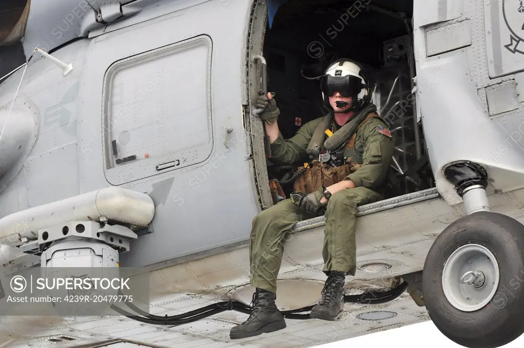 Caribbean Sea, October 20, 2012 - Naval Aircrewman acts as an observer in an SH-60B Sea Hawk helicopter