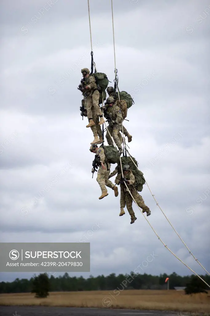 February 5, 2013 - U.S. Soldiers with the 7th Special Forces Group (Airborne), are lifted off the ground by a CH-47 Chinook helicopter during Special Purpose Insertion Extraction (SPIE) training at Eglin Base Air Force Base, Florida. 
