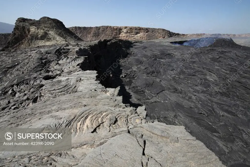 January 30, 2011 - South pit crater filled by basaltic lava flows with inactive hornito to left, Erta Ale volcano, Danakil Depression, Ethiopia.